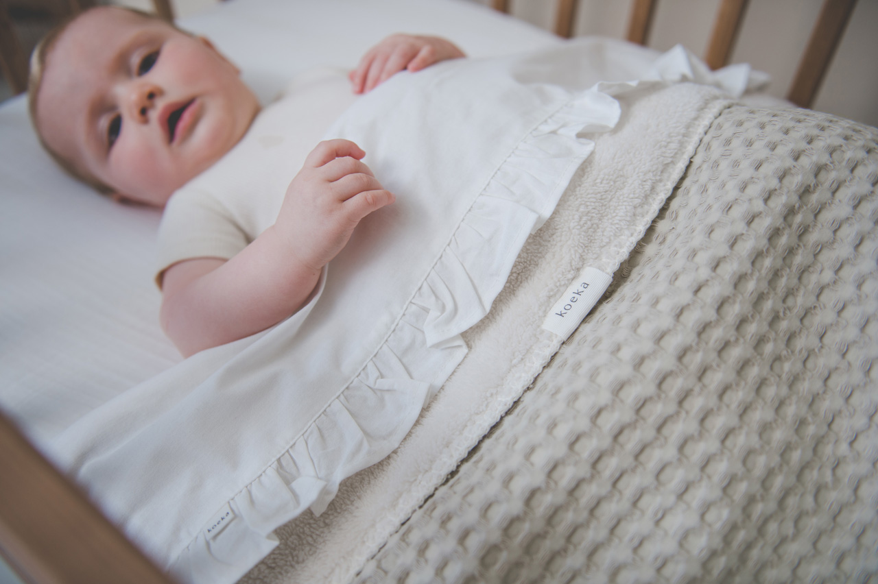 Cot blanket teddy Oslo sand/pebble